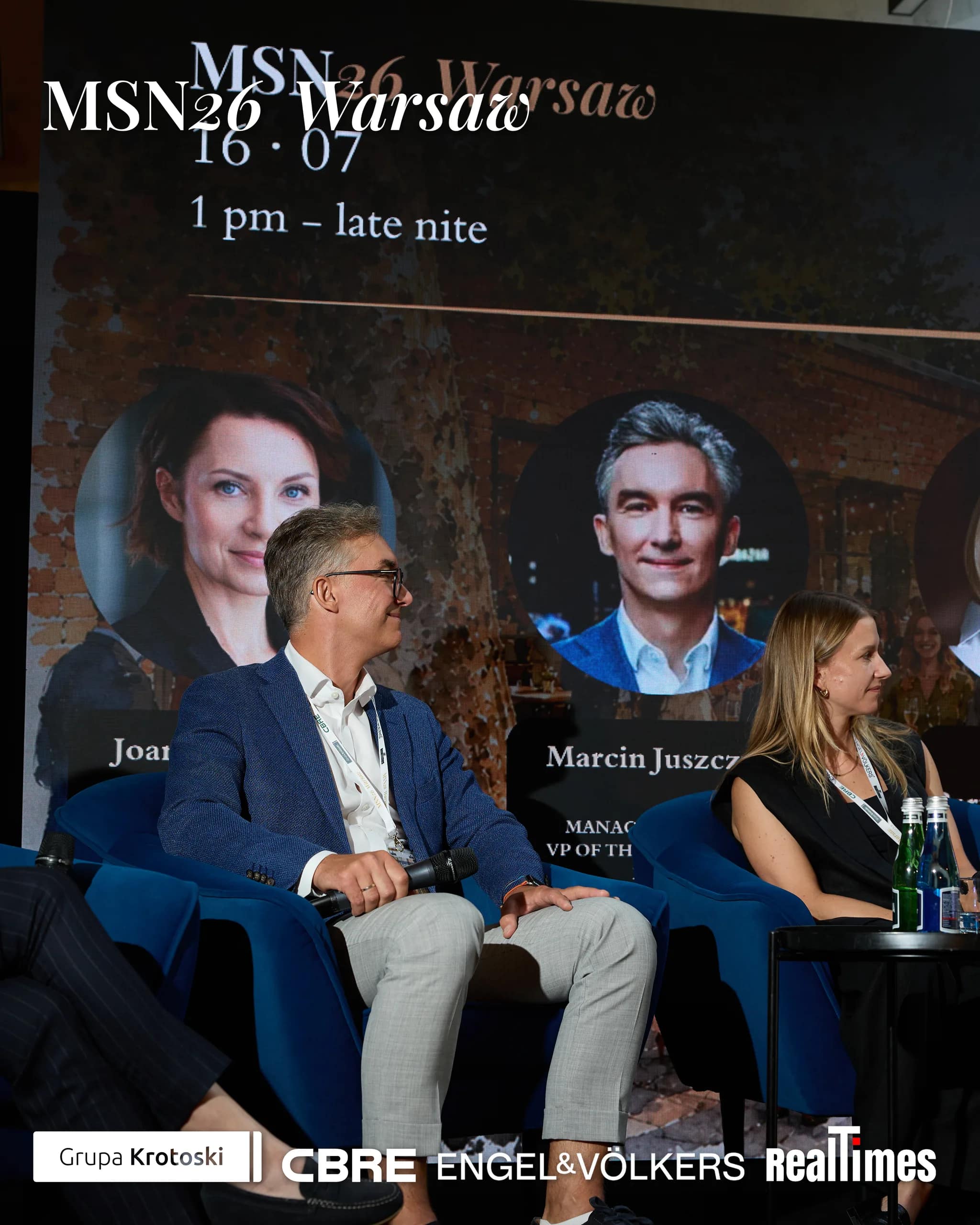 Mid-Summer Night 2026 at B'Fort, Warsaw: two panelists seated on stage armchairs