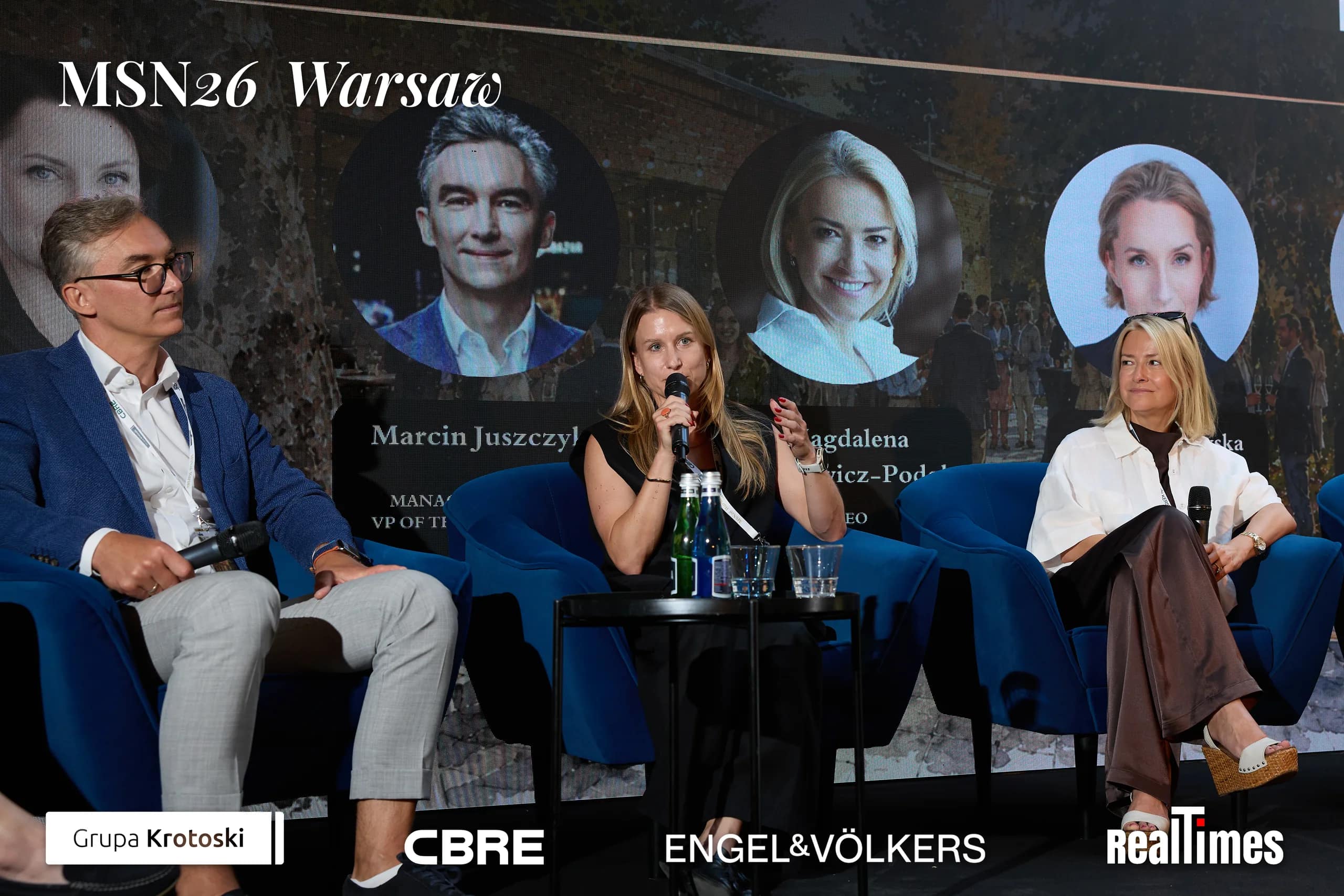 Mid-Summer Night 2026 at B'Fort, Warsaw: man + panelist gesturing on stage