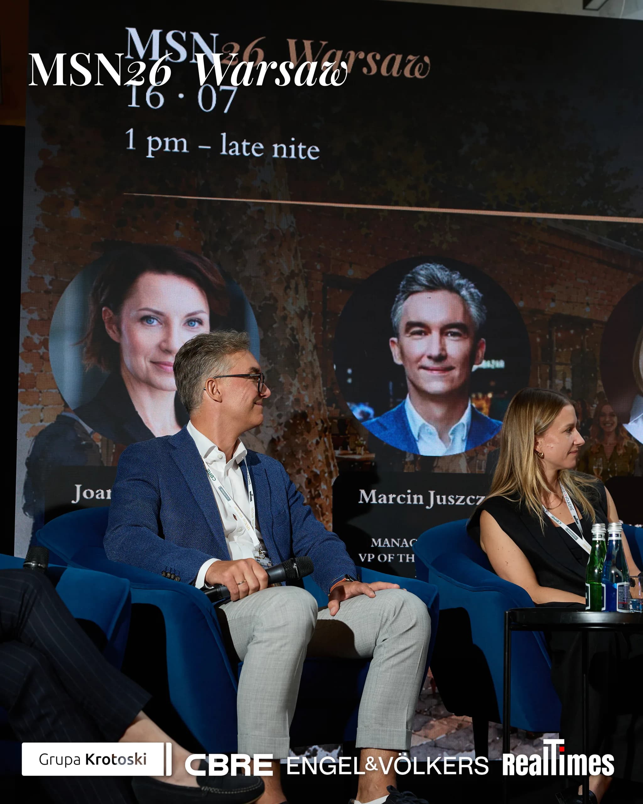 Mid-Summer Night 2026 at B'Fort, Warsaw: two panelists seated on stage armchairs