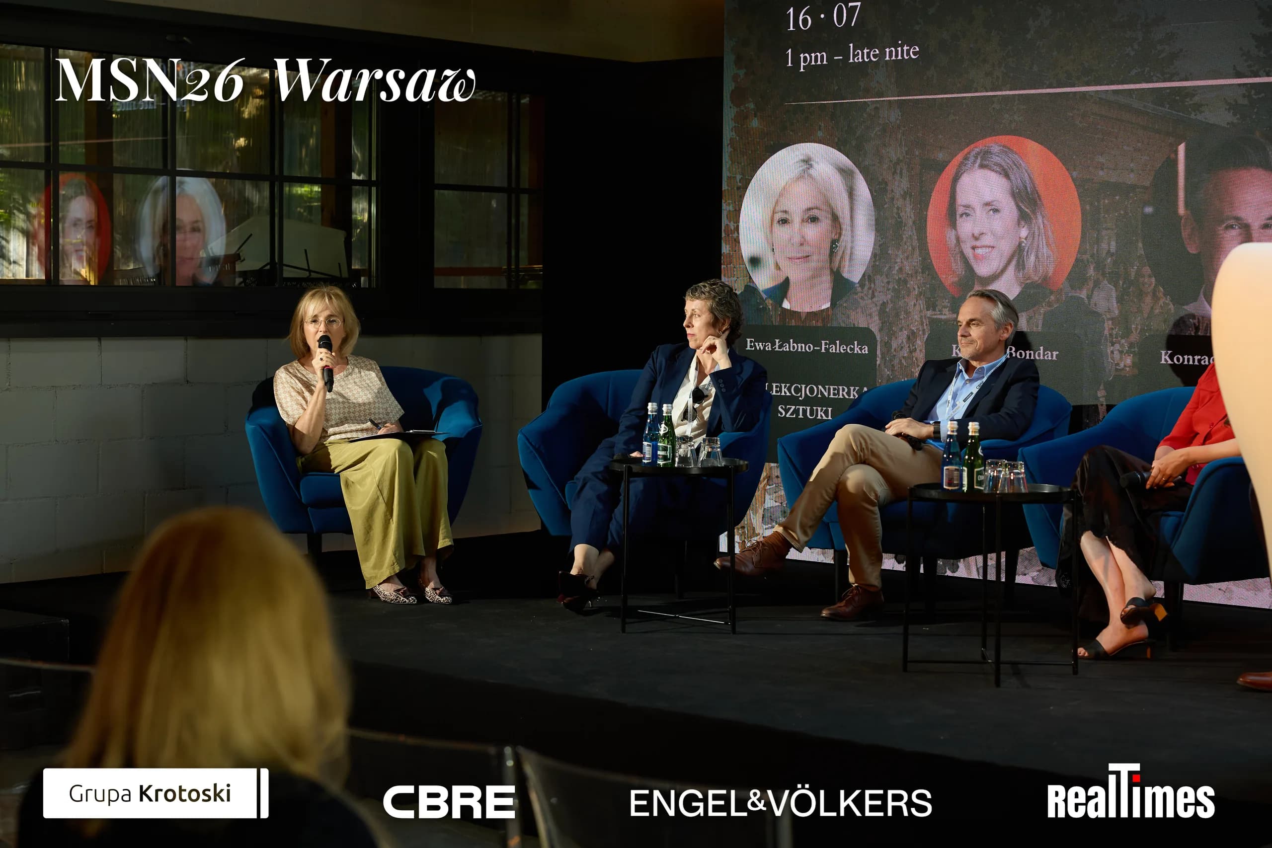 Mid-Summer Night 2026 at B'Fort, Warsaw: row of panelists on stage