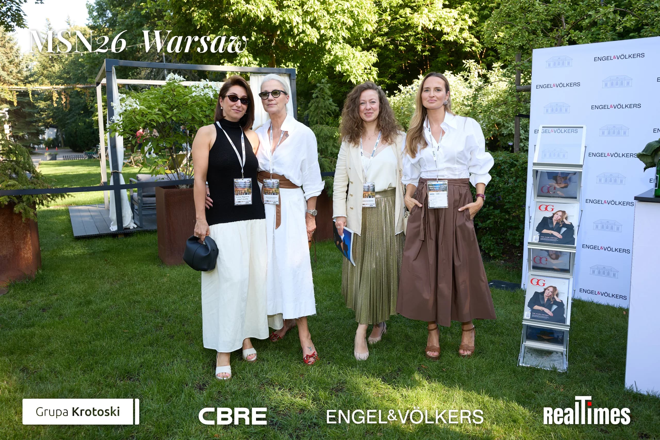 Mid-Summer Night 2026 at B'Fort, Warsaw: group posing at garden booth