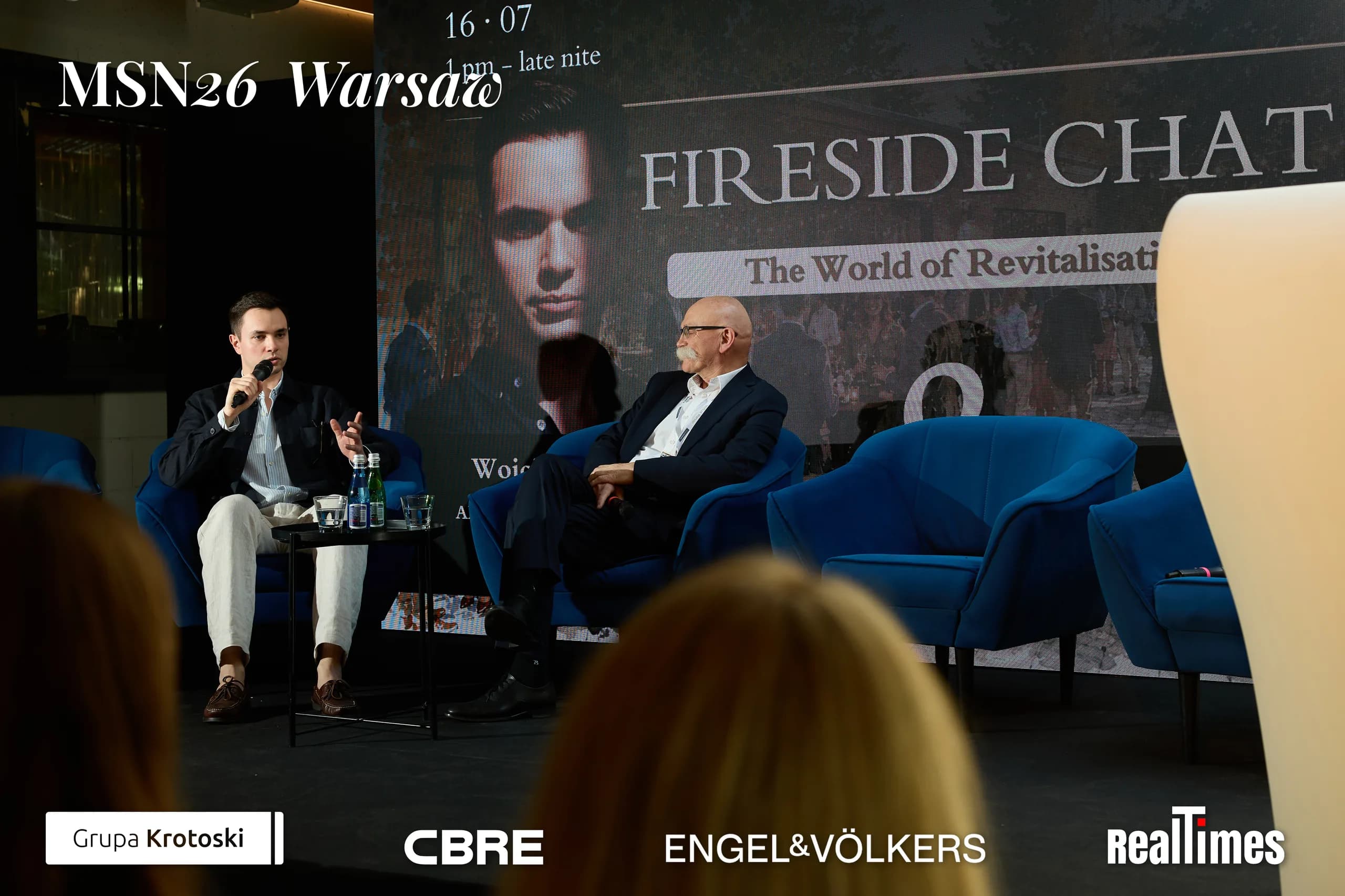 Mid-Summer Night 2026 at B'Fort, Warsaw: Fireside Chat backdrop, host and guest seated