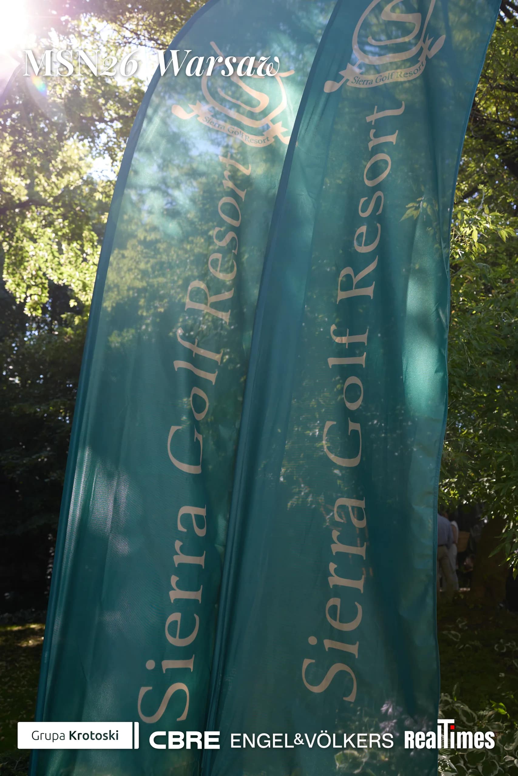 Mid-Summer Night 2026 at B'Fort, Warsaw: Sierra Golf Resort banners in garden