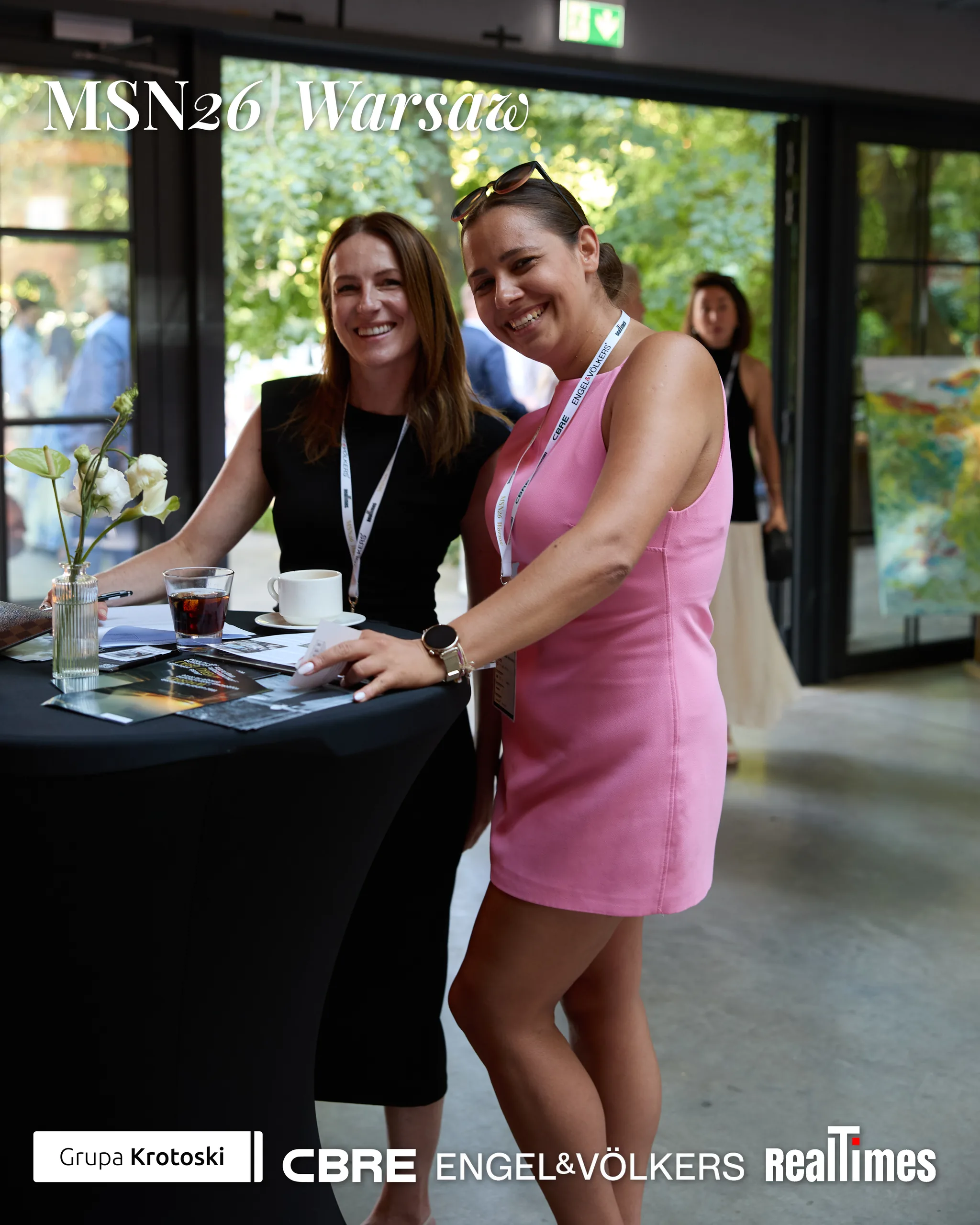 Mid-Summer Night 2026 at B'Fort, Warsaw: two women posing at cocktail table
