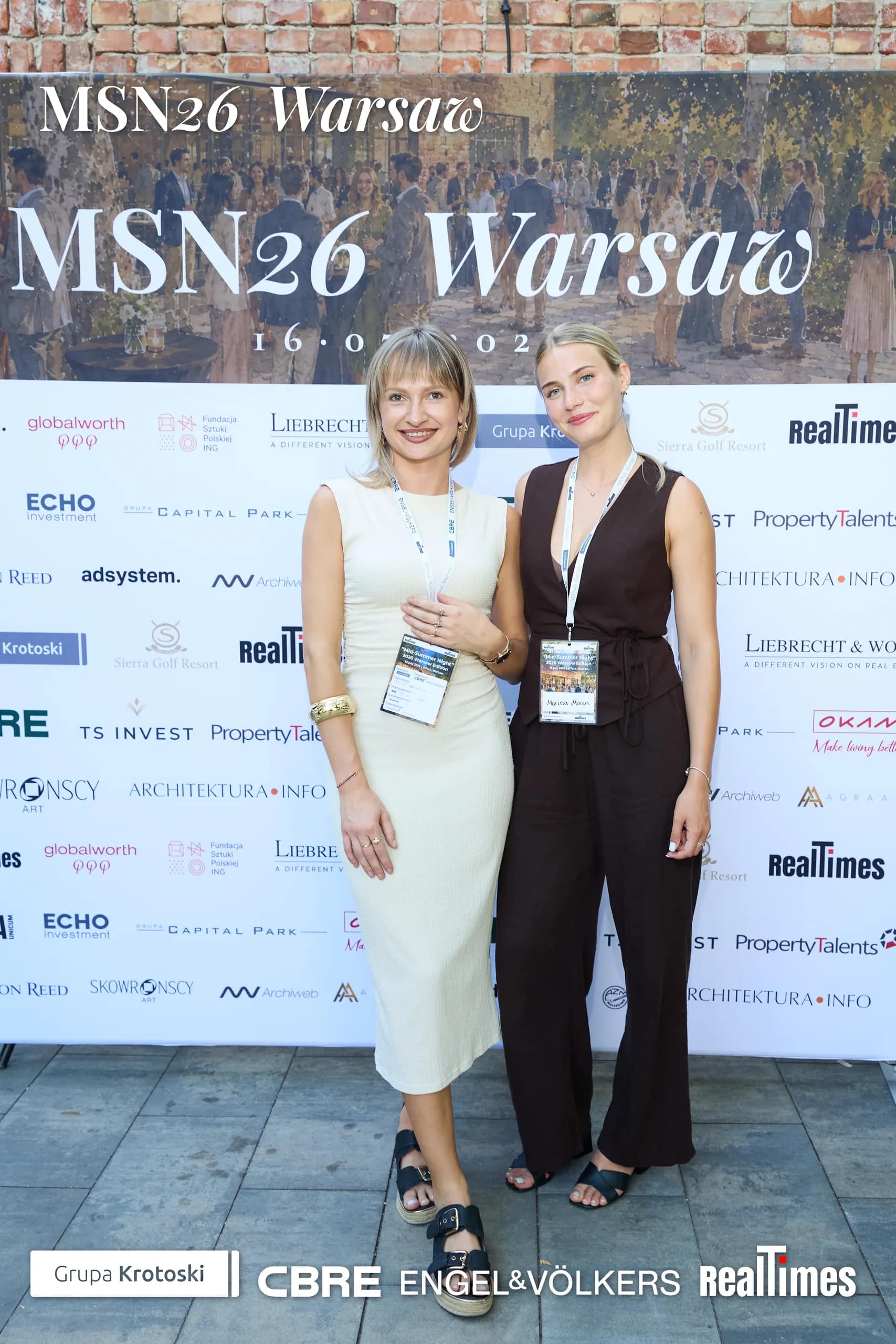 Mid-Summer Night 2026 at B'Fort, Warsaw: two women posing at MSN26 sponsor photowall