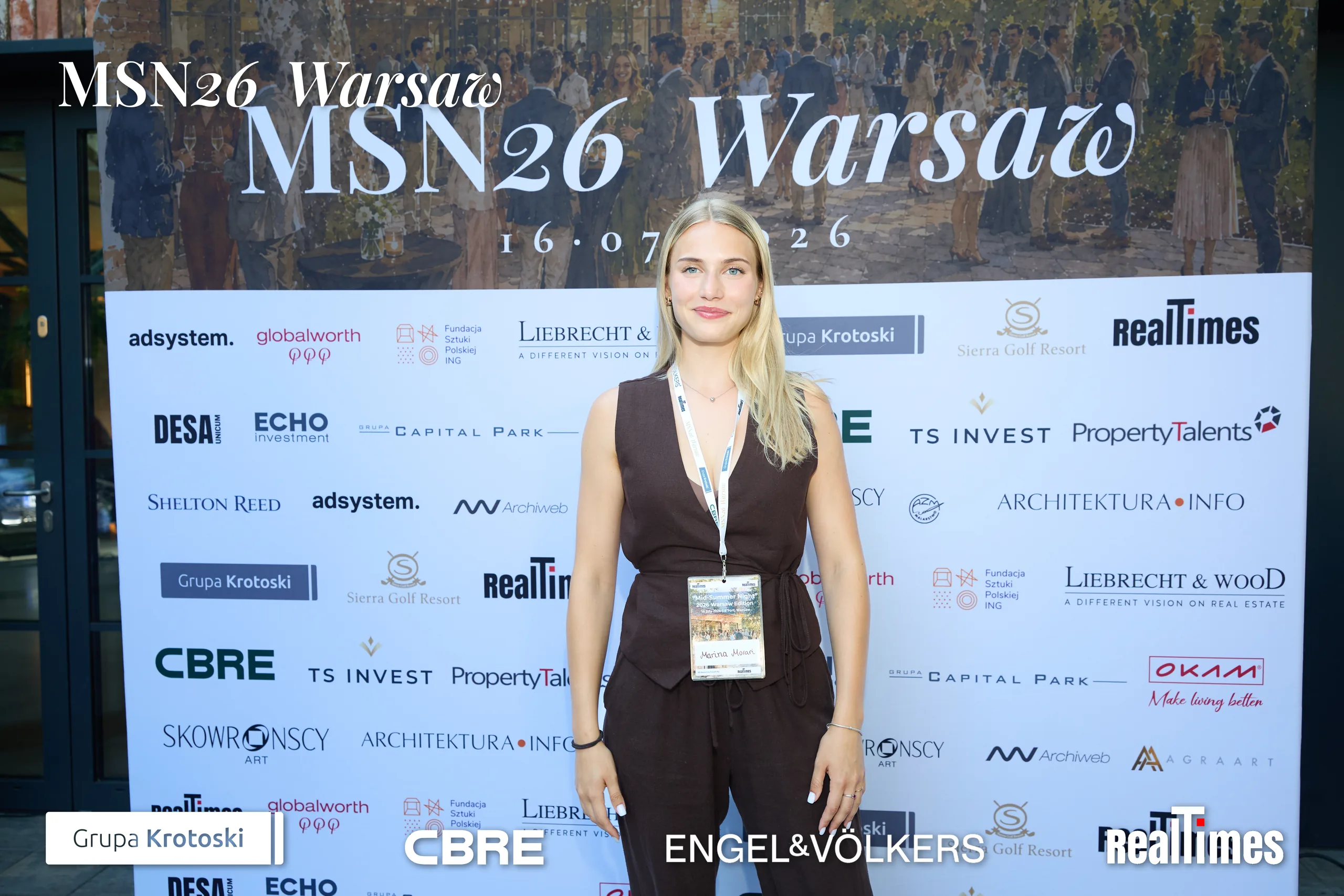 Mid-Summer Night 2026 at B'Fort, Warsaw: woman posing at sponsor photowall