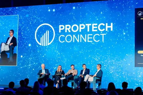 The view from the audience at PropTech Connect Europe 2026 in London, with Alexander Morari on the side screen.