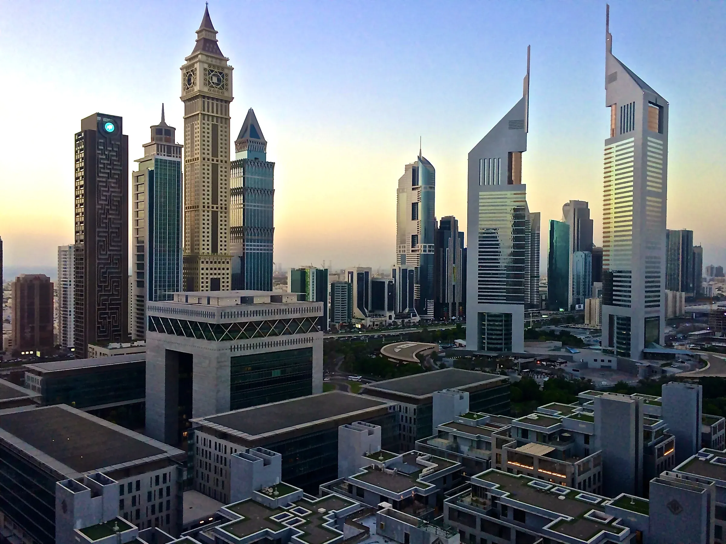 Emirates Towers and The Gate building at dawn, prime offices where tenants ask landlords for certainty