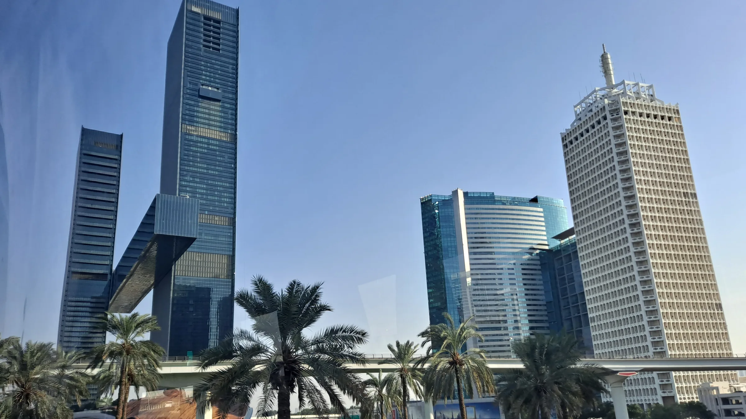 Glass office towers and palms along Sheikh Zayed Road, the prime corridor where Grade A space is tightest