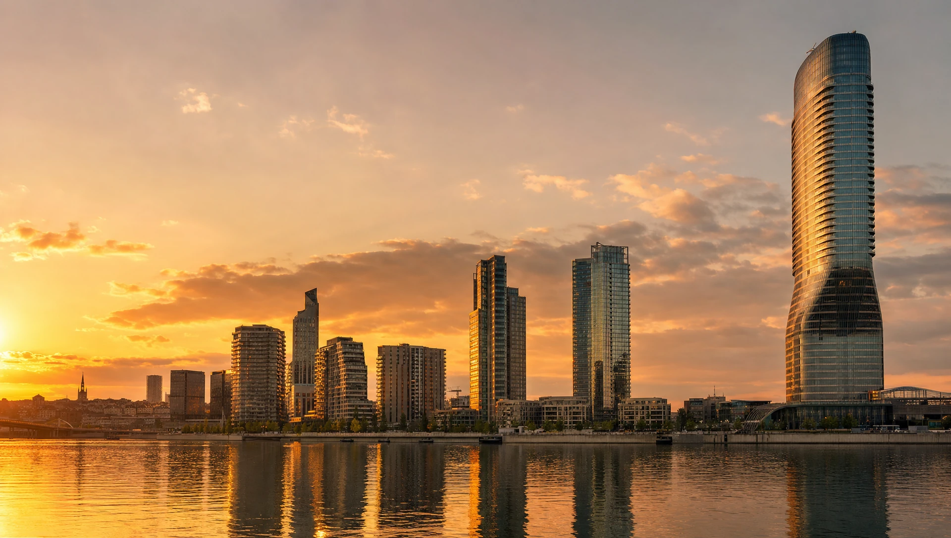 Belgrade riverside skyline at golden hour, glass towers reflecting in the water at the Sava and Danube confluence.