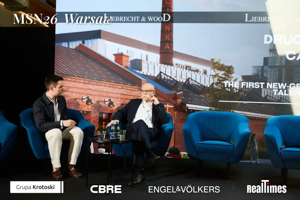 Mid-Summer Night 2026 at B'Fort, Warsaw: two seated in armchairs on stage, interview format
