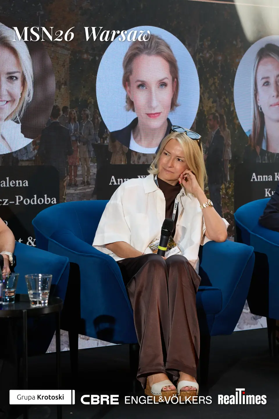 Mid-Summer Night 2026 at B'Fort, Warsaw: panelist seated, panel headshot backdrop