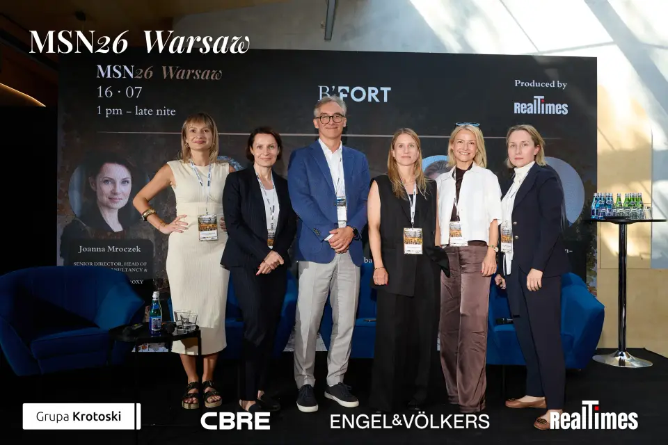 Mid-Summer Night 2026 at B'Fort, Warsaw: six-person panel group photo on stage