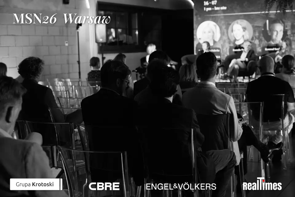Mid-Summer Night 2026 at B'Fort, Warsaw: b&w audience watching stage panel