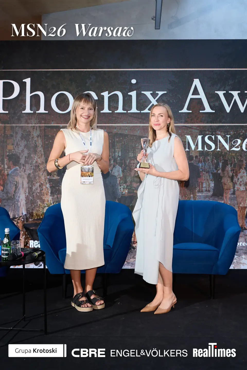 Mid-Summer Night 2026 at B'Fort, Warsaw: two women with trophy, awards backdrop