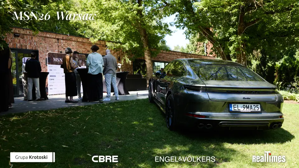 Mid-Summer Night 2026 at B'Fort, Warsaw: sponsor car and registration desk outdoors