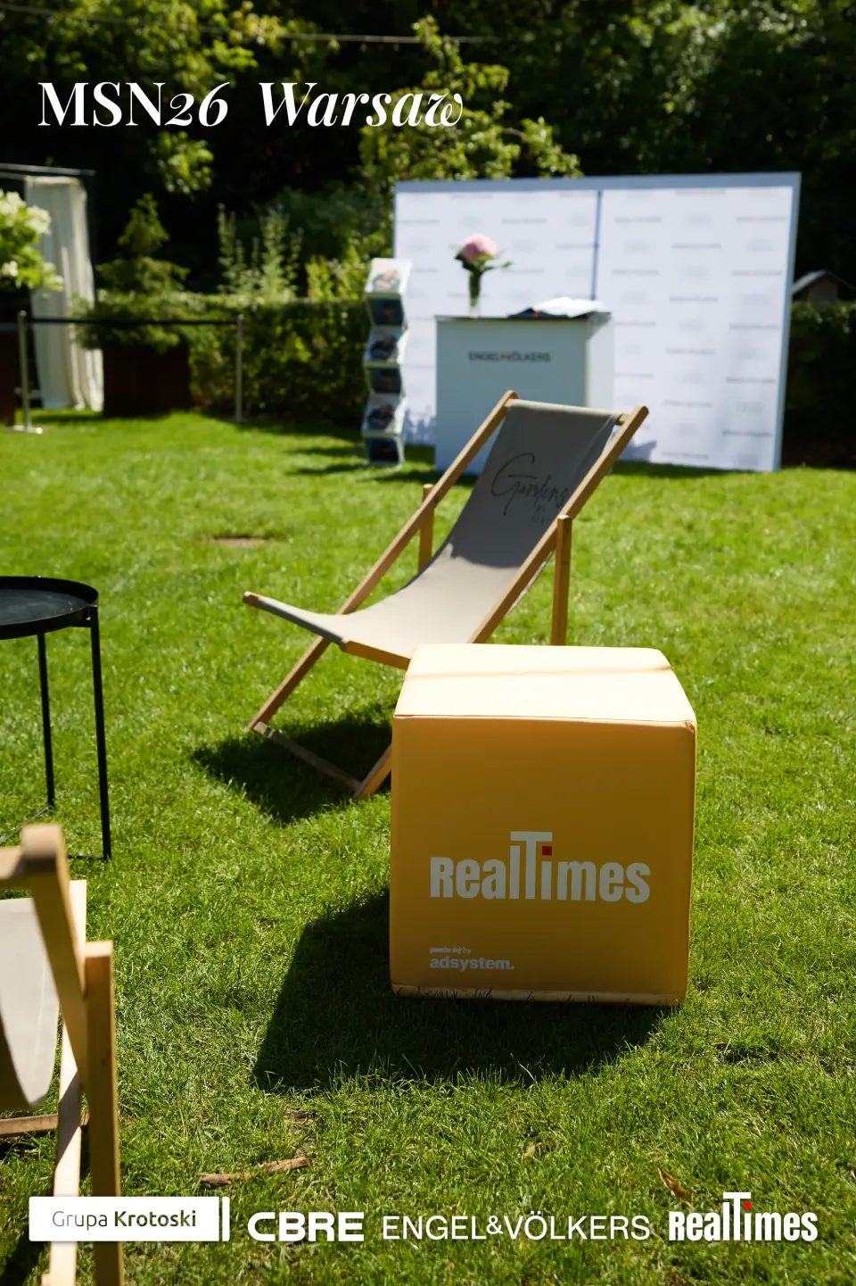 Mid-Summer Night 2026 at B'Fort, Warsaw: RealTimes branded lounge props in garden