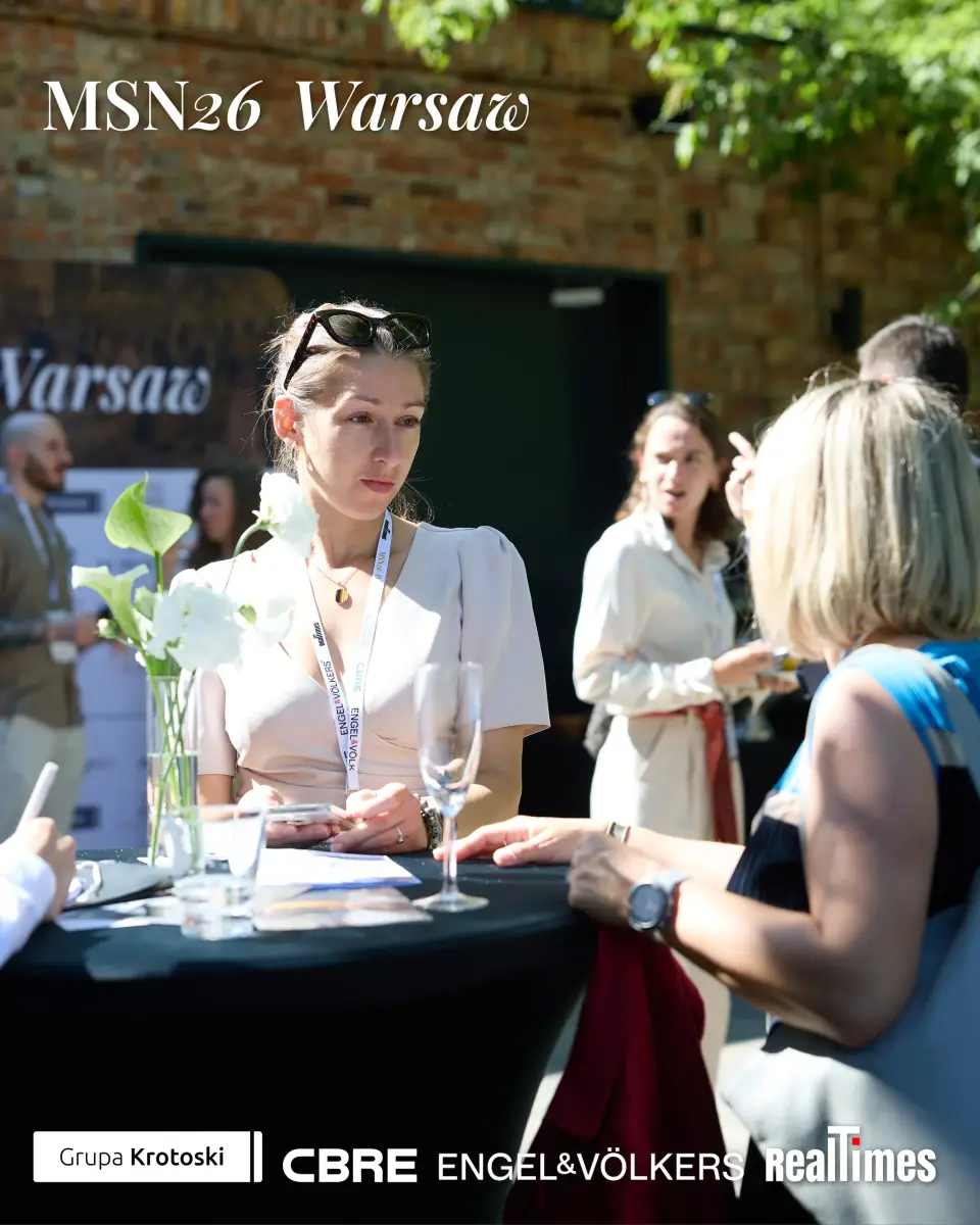 Mid-Summer Night 2026 at B'Fort, Warsaw: woman networking at high table outdoors