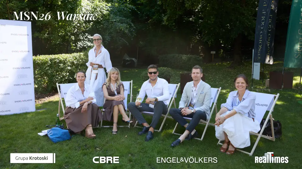 Mid-Summer Night 2026 at B'Fort, Warsaw: group posing in deck chairs on lawn