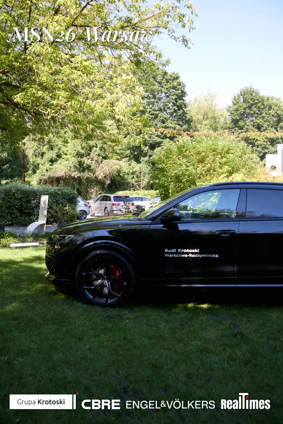 Mid-Summer Night 2026 at B'Fort, Warsaw: Audi car display on lawn, venue detail