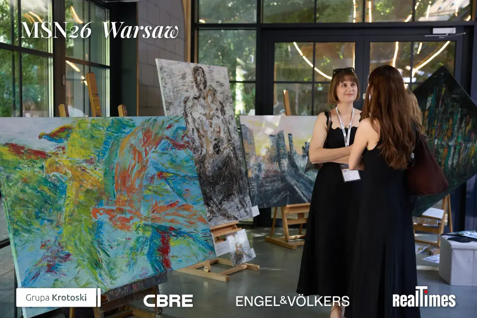 Mid-Summer Night 2026 at B'Fort, Warsaw: guests viewing paintings at the indoor art exhibition