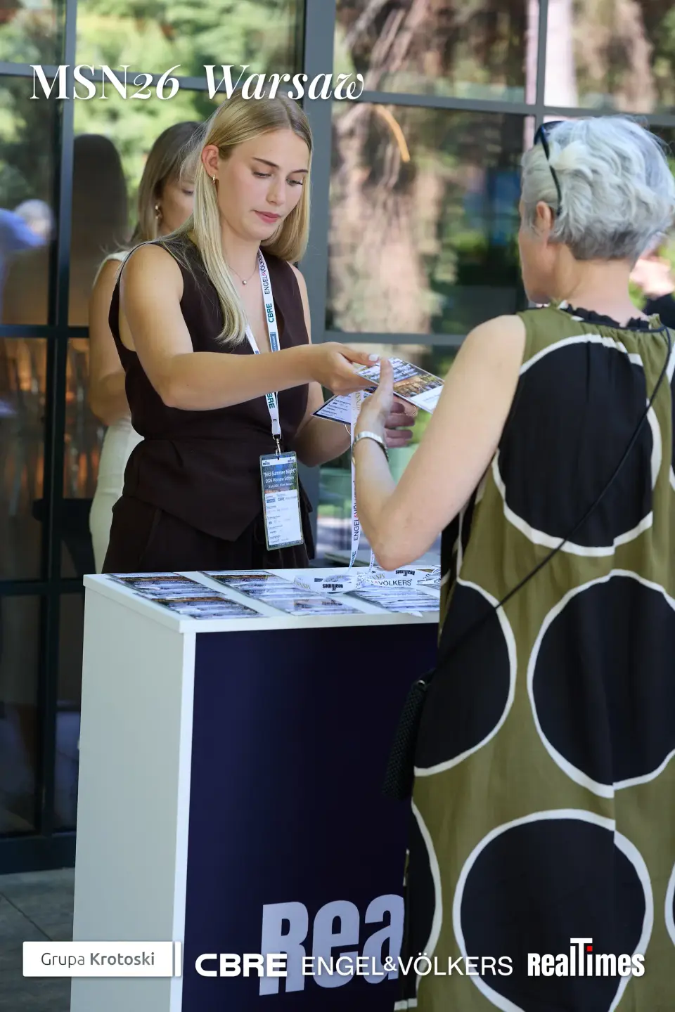 Mid-Summer Night 2026 at B'Fort, Warsaw: materials/registration desk handoff