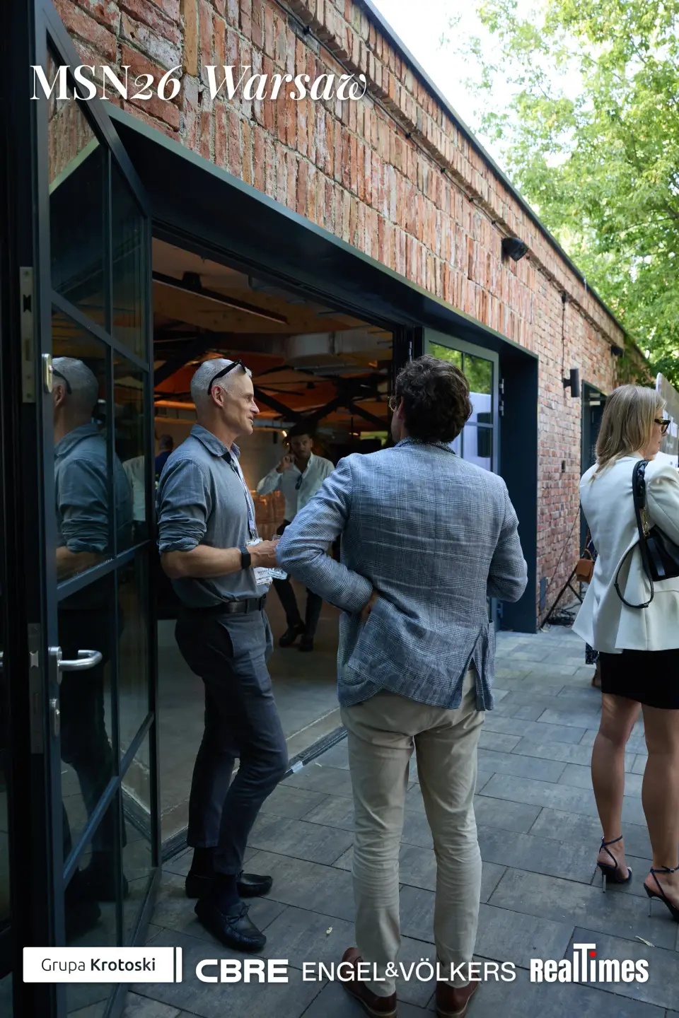 Mid-Summer Night 2026 at B'Fort, Warsaw: men shaking hands at venue doorway