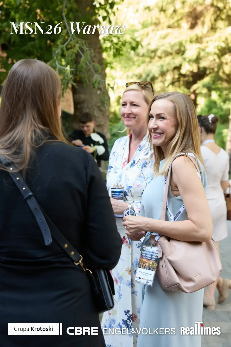 Mid-Summer Night 2026 at B'Fort, Warsaw: women mingling outdoors, garden networking