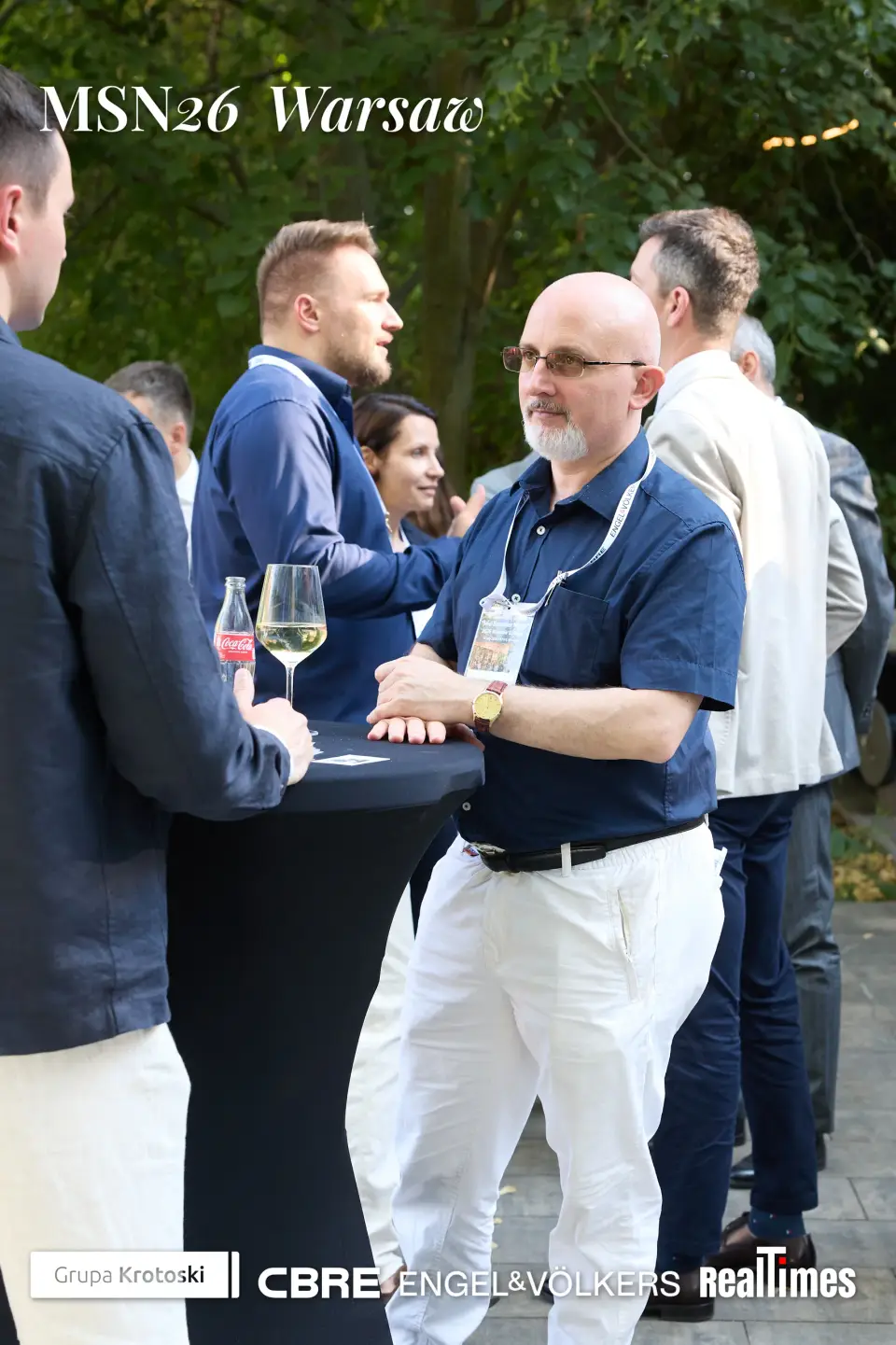 Mid-Summer Night 2026 at B'Fort, Warsaw: men with wine at cocktail table