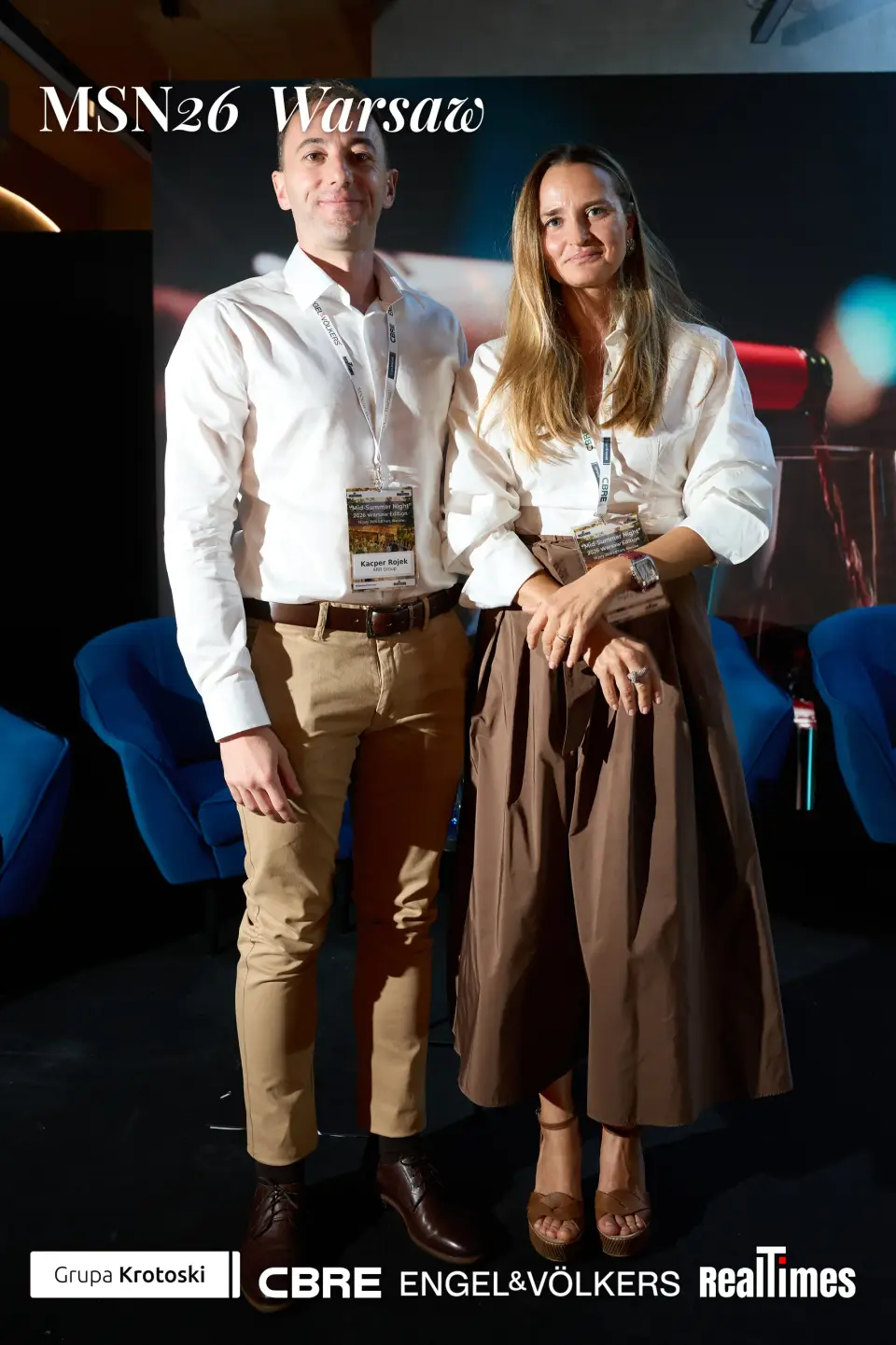 Mid-Summer Night 2026 at B'Fort, Warsaw: speaker pair posing on awards stage | QA-adjudicated: networking/posed portrait, not stage