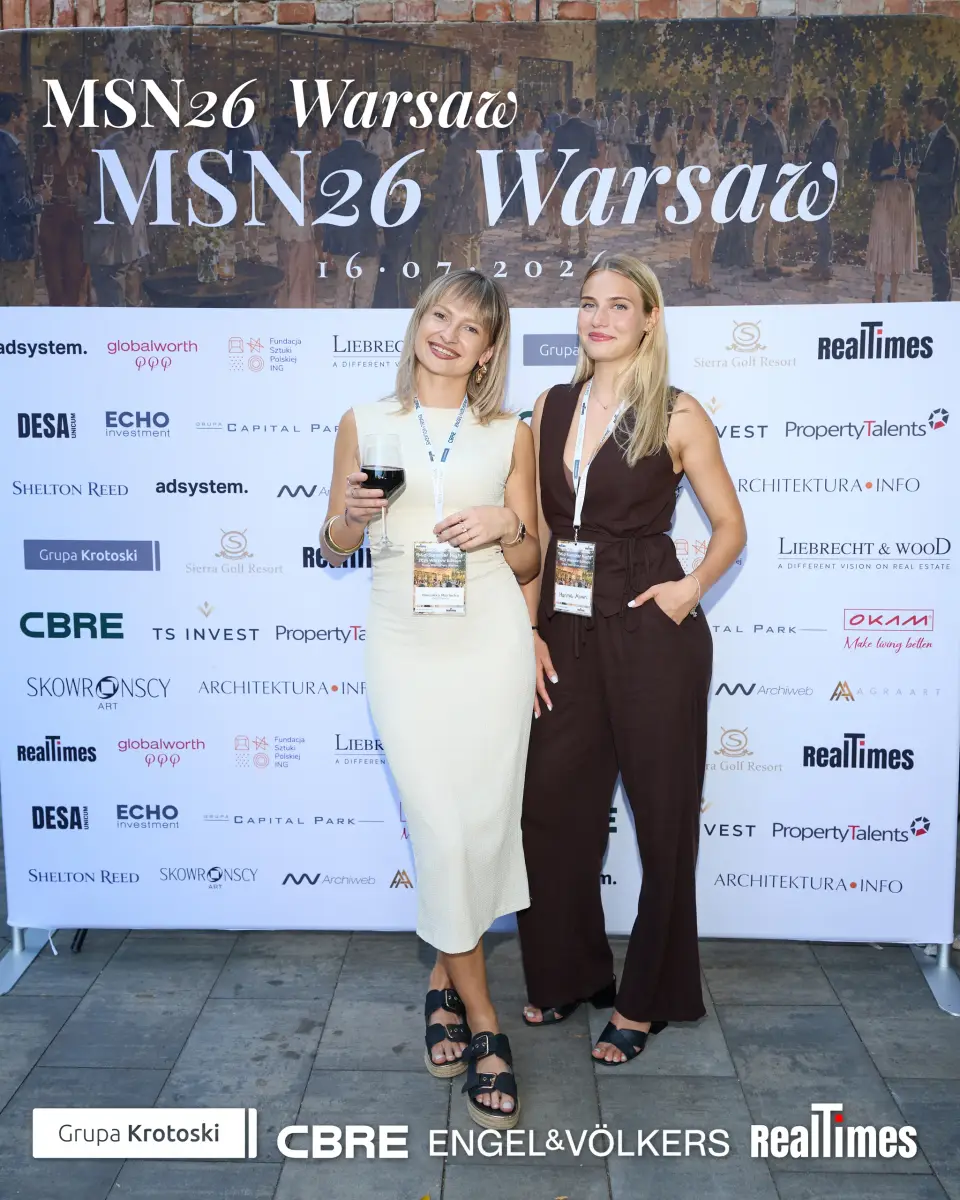 Mid-Summer Night 2026 at B'Fort, Warsaw: two women with wine at sponsor photowall